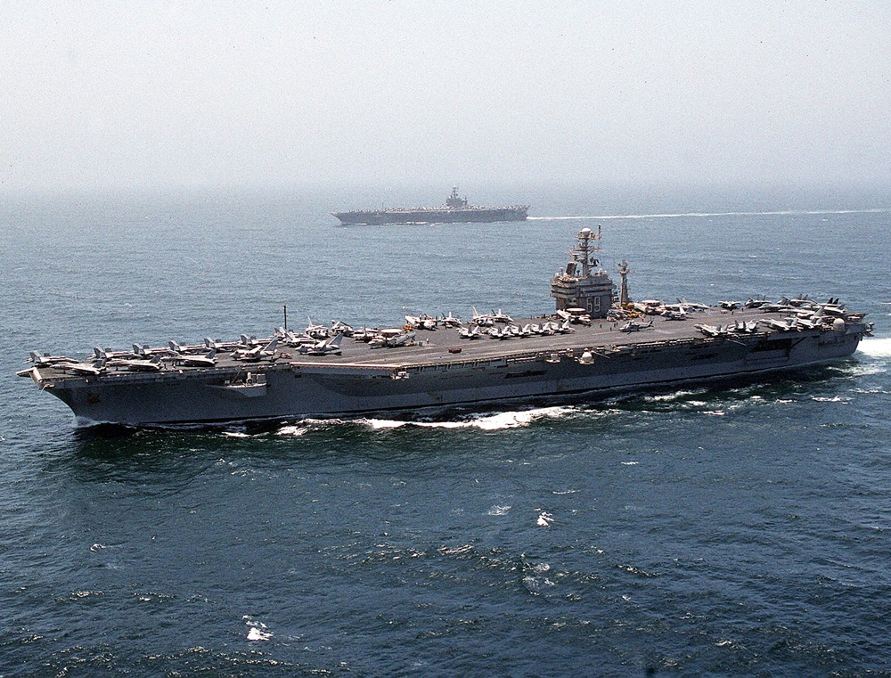 Why did the Eisenhower aircraft carrier reach the Arabian Gulf?